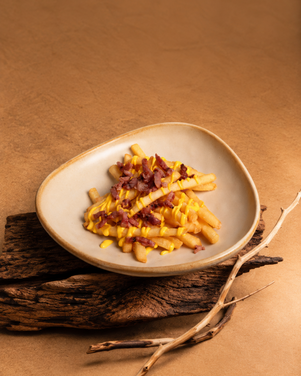 Patatas con queso y bacon